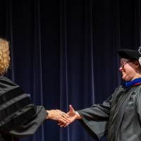 Provost and recipient shaking hands
